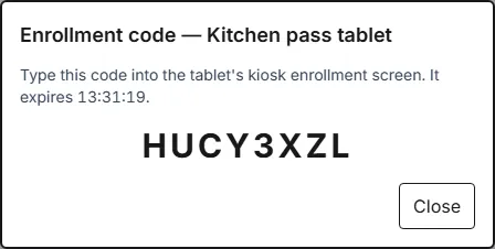 The Enrollment code dialog for the Kitchen pass tablet, showing a one-off code and the time it expires.